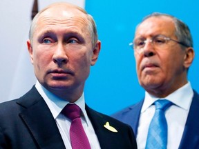 Russian President Vladimir Putin and Russian Foreign minister Sergei Lavrov are pictured prior the meeting with Turkish President Recep Tayyip Erdogan at the G20 summit in Hamburg on July 8, 2017.