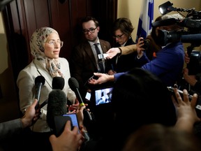 Canada's new anti-Islamophobia representative, Amira Elghawaby, speaks to the media on Parliament Hill Feb. 1. She has come under attack from Quebec politicians.