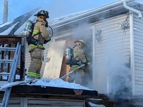 Ottawa firefighters battle a blaze at an abandoned building on St. Paul Street in Vanier on Sunday, Feb. 26, 2023.