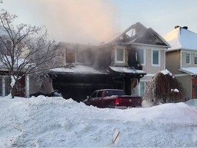 Four people suffered frostbite fleeing this house fire in Stittsville early Saturday.