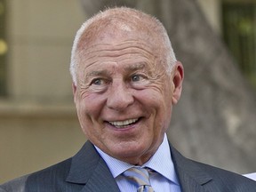 FILE - Attorney Tom Girardi smiles outside the Los Angeles courthouse on Wednesday, July 9, 2014. Disbarred attorney Girardi makes his first appearance Monday, Feb. 6, 2023, in federal court on charges that he embezzled millions of dollars from some of the large settlements he won for clients.