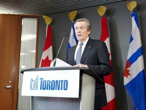 Toronto Mayor John Tory speaks during a press conference at City Hall in Toronto on Friday, Feb. 10, 2023.