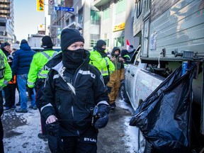 A file photo shows an unidentified Ottawa bylaw officer in the downtown core during last winter's convoy protest..