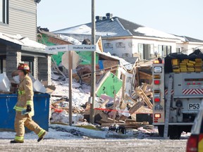 An explosion destroyed four houses under construction on Blossom Pass Terrace Monday, Feb. 13, 2023. Ottawa fire, police and paramedic services were on the scene.