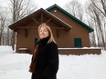 Madeleine Meilleur, general manager of Muséoparc Vanier, stands in front of the rebuilt Vanier Sugar Shack.