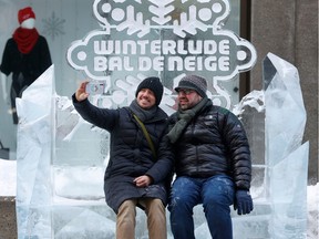 Kyle Jones and Ekrem Dimbiloglu from Atlanta Georgia take a selfie during the first day of Winterlude on Sparks Street Friday. Kyle and Ekrem have visited Ottawa a total of four times to take in Winterlude over the years and were sad to miss it for two years during COVID-19.