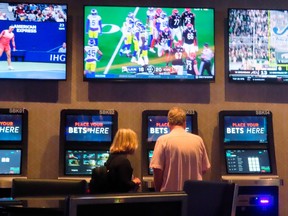 A customer makes a sports bet at the Ocean Casino Resort in Atlantic City, N.J. Even in Canada, sports betting has become too easy, some readers say.