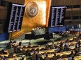 FILE - Video monitors show member nation vote in the United Nations General Assembly in favour of a resolution condemning Russia's illegal referendum in Ukraine, on Oct. 12, 2022 at U.N. headquarters. Ukraine's supporters have circulated a proposed resolution for adoption by the 193-member U.N. General Assembly on the eve of the first anniversary of Russia's invasion of its smaller neighbour. The proposed resolution, obtained Friday, Feb. 10, 2023, by The Associated Press, is broader and less detailed than Ukrainian President Volodymyr Zelenskyy's 10-point peace plan.