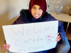Nasro Mohamed recently joined Brockville supporters to draw up 'Welcome' signs for her husband and young daughter, who are scheduled to arrive in Ottawa on Wednesday.