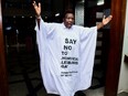 Ugandan MP John Musira, dressed in a robe with anti-gay slogans, leaves the chambers during the debate of the anti-homosexuality bill in Kampala, Uganda on March 21.