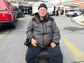 Kirk Brown, one of the residents displaced by the closure of the Care Centre in Cornwall, sits outside the facility on Friday morning.