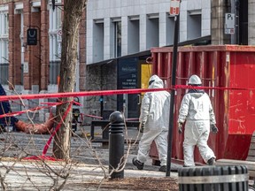 Montreal employees in hazmat suits helped with the DNA collection when bodies were removed from the rubble of an Old Montreal fire.