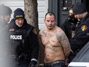 Michelle Berg's photo of the arrest of William Jack Henderson is nominated in the breaking news category.