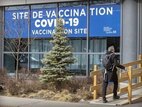 A man enters the COVID-19 vaccination clinic on Parc Ave. in Montreal on Monday April 11, 2022.