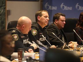 Steve Bell (L) and Chief Eric Stubbs of the Ottawa Police Service attended the Ottawa City Council debate of the city budget at Ottawa City Hall, March 1, 2023.