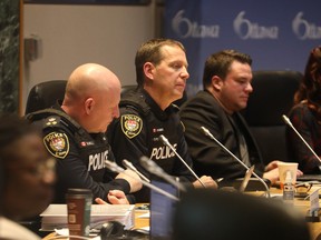 Ottawa Police Service Chief Eric Stubbs (centre) was at city council March 1 for the budget debate. That budget included a $15.2-million boost for the police.