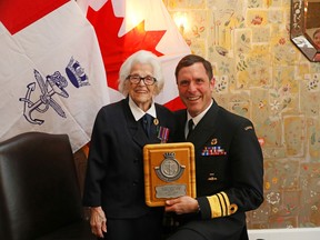Commander, Royal Canadian Navy – Vice Admiral Angus Topshee presents an award to Ms. Elsa Lessard.
