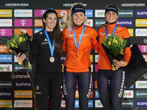 From left, second placed Canada's Ivanie Blondin, first placed Netherlands' Marijke Groenewoud and third placed Netherlands' Irene Schouten celebrate on the podium at the end of the Mass Start Women event of the World Championships at Thialf ice arena Heerenveen, Netherlands, Saturday, March 4, 2023. Blondin skated to a silver medal in the women's mass start at the world speed skating championships on Saturday.