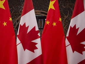 Canadian and Chinese flags seen prior to a meeting of Canada's Prime Minister Justin Trudeau and China's President Xi Jinping at the Diaoyutai State Guesthouse in Beijing in 2017.