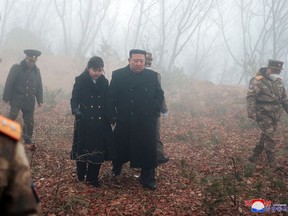 North Korean leader Kim Jong Un walks with his daughter Kim Ju Ae at an undisclosed location in this image released by North Korea's Central News Agency.