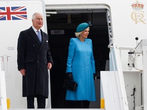 Britain's King Charles III and Britain's Camilla, Queen Consort get off their plane after landing at Berlin Brandenburg Airport in Schoenefeld near Berlin, on March 29, 2023.