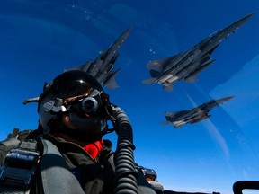 This handout photo taken and released by the US Air Force on July 30, 2017 shows a US Air Force pilot  join up with Republic of Korea air force F-15s during a 10-hour mission from Andersen Air Force Base, Guam, into Japanese airspace and over the Korean Peninsula. North Korea on August 8, 2017, said that it is considering strikes near US strategic military installations in Guam with its intermediate range ballistic missiles, state news agency KCNA reported. The threat came hours after US President Donald Trump threatened Pyongyang with "fire and fury" over its missile program and days after the UN Security Council levied new sanctions on North Korea over its growing nuclear arsenal.