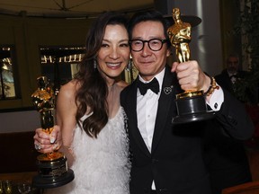 Best Supporting Actor Ke Huy Quan and Best Actress Michelle Yeoh pose with their awards following the Oscars show at the 95th Academy Awards in Hollywood March 12.