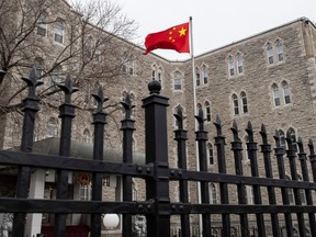 The flag files outside the Embassy of China in Ottawa. Federal government officials and media are scrambling over leaked reports of election interference by Beijing.