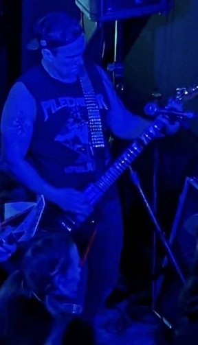 Ottawa detective Kirk Gidley playing with the thrash metal band Infrared.
