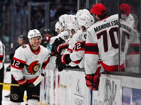 Ottawa Senators right wing Alex DeBrincat (12) celebrates with the bench after scoring a goal against the Seattle Kraken during the third period at Climate Pledge Arena. Ottawa defeated Seattle 5-4.