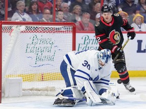 Toronto Maple Leafs goalie Matt Murray (30) makes a save in front of Ottawa Senators right wing Alex DeBrincat (12) the first period at the Canadian Tire Centre.