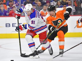 New York Rangers right wing Vladimir Tarasenko (91) battles for the puck against Philadelphia Flyers centre Patrick Brown (38), March 1, 2023. The Ottawa Senators acquired Brown from the Flyers for a sixth-round draft pick on Friday.