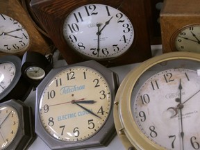 Antique clocks are displayed at the Electric Time Company, in Medfield, Massachusetts on March 5, 2020. U.S. legislation that could trigger an end to seasonal time changes in Canada is moving forward again, as Canadians get ready to wind their clocks ahead an hour before going to bed Saturday night.
