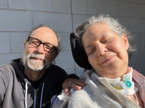 MaryAnn Harris, with her husband Charles de Lint, is unable to move herself after a tick bite transmitted the rare but increasingly common Powassan virus.