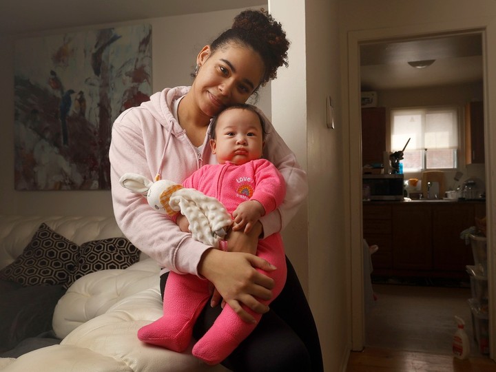  Jessica Kiala poses for a photo with her daughter Deborah at their home in Ottawa Tuesday. Jessica is a young single mom – a refugee from Angola – who has received support from Ottawa Public Health’s healthy babies, healthy children program which is having difficulty keeping up with demand. 
