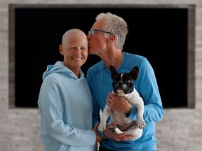 Sindy Hooper, shown here with husband, Jonathan, and their dog Lexey, has stage IV pancreatic cancer.