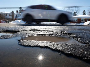 Potholes pepper Smyth Road in Ottawa this past week. They're a common problem at this time of year.