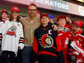 Actor Ryan Reynolds attending the Ottawa Senators game at the Canadian Tire Centre in Ottawa Thursday night. Reynolds climbed over the wall of the box next to his to greet some young Senators fans.