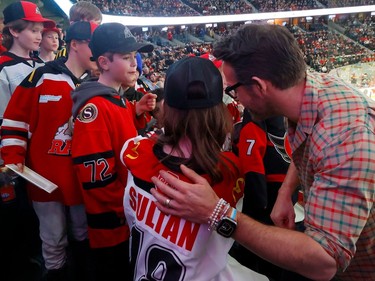 OTTAWA - March 30, 2023 -  Actor Ryan Reynolds attending the Ottawa Senators game at the Canadian Tire Centre in Ottawa Thursday night. Ryan climbed over the wall of the box next to his to greet some young Senatror fans. TONY CALDWELL, Postmedia.