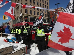 Police confront protesters during the trucker convoy occupation of downtown Ottawa in early 2022. Clear communication between members of the police services board was sometimes lacking.