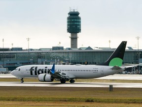 A Flair Airlines plane lands at Vancouver International Airport in December.
