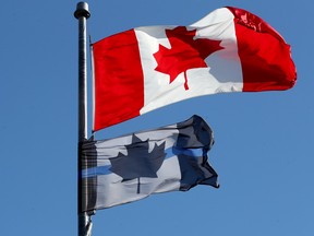 A thin blue line flag flies at the Ottawa Police Association headquarters, located downtown on Catherine Street.