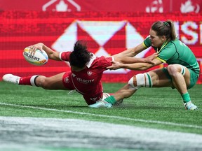 Canada's Fancy Bermudez, left, scores her second try past Ireland's Beibhinn Parsons during HSBC Canada Sevens women's rugby action, in Vancouver, B.C., Sunday, March 5, 2023.&ampnbsp;Bermudez scored a pair of tries as the Canadian women defeated Ireland 24-12 Sunday to put themselves in position for there best result this season at the HSBC Canada Sevens Tournament.