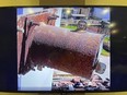 This image made on March 14, 2023, from the 2022 video provided by the Prachinburi Provincial Public Relations Office, shows a radioactive cylinder, a steel tube, 30 cm (12 inches) long and 13 cm (5 inches) diameter that has gone missing from a steam power plant in Thailand's eastern province of Prachinburi. The video was taken in December 2022. (The Prachinburi Provincial Public Relations Office via AP)