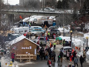 People gathered in downtown Ottawa during the Freedom Convoy protest, Sunday, Feb. 6, 2022. Mid day Sunday, a structure and many people were still in the area around Confederation Park and the Canal.