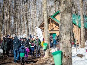 Crowds in front of the restored sugar shack.