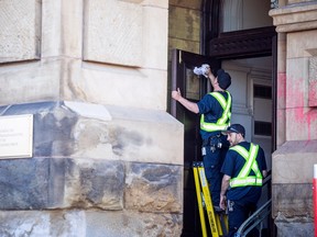 On2Ottawa protest climate change and threw red paint on the Office of the Prime Minister and Privy Council, formerly the Langevin Block where Prime Minister Justin Trudeau’s office is. There were crews on scene cleaning up the paint Saturday, April 15, 2023.