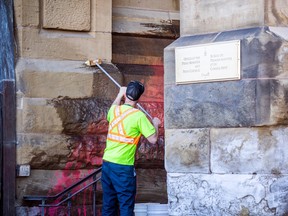 On2Ottawa protest climate change and threw red paint on the Office of the Prime Minister and Privy Council, formerly the Langevin Block where Prime Minister Justin Trudeau's office is. There were crews on scene cleaning up the paint Saturday, April 15, 2023.