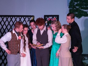 Algernon Moncrieff played by Daniel Kingdom (L),  Cecily Cardew played by Adele Grootenboer (2nd FL),  Lady Bracknell played by Caitlyn McPherson (3rd FL), John "Jack" Worthing played by Joseph Carriere (M), Gwendolen Fairfax played by Phoebe Stassen (3rd FR), Miss Prism played by Shannon Jaspers-Fayer (2nd FR), Rev. Canon Chasuble D.D. played by Ryne Hoekema (R), during Redeemer Christian High School's Cappies production of The Importance of Being Earnest, held on April 22, 2023.