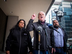 The Public Service Alliance of Canada (PSAC) held a media update at the corner of Kent and Queen Streets, Saturday, April 22, 2023. From left: Sharon DeSousa, PSAC national executive vice-president; Chris Aylward, PSAC national president; and Alex Silas, PSAC regional executive vice-president.